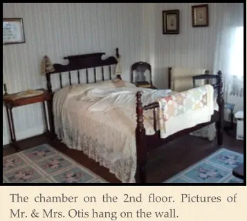 The chamber on the 2nd floor. Pictures of Mr. & Mrs. Otis hang on the wall.